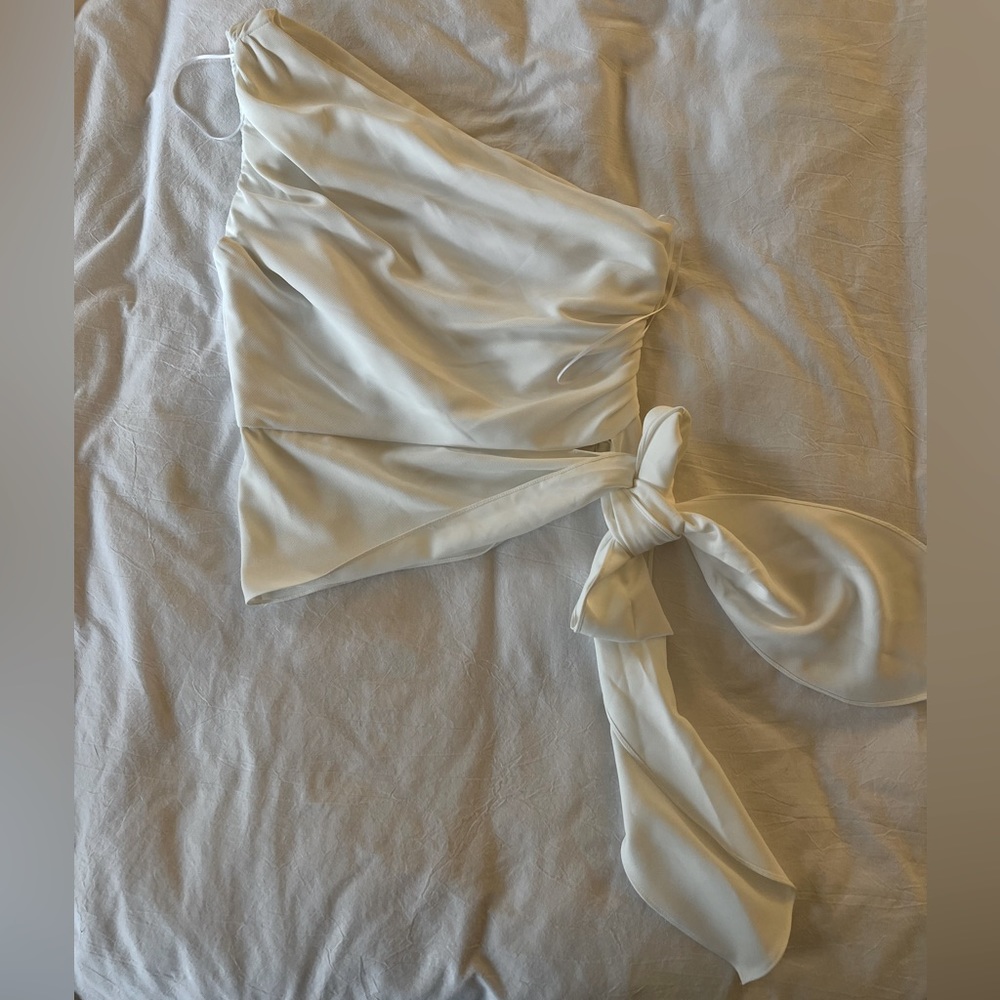 Amanda Uprichard one-shoulder blouse with sash detail.